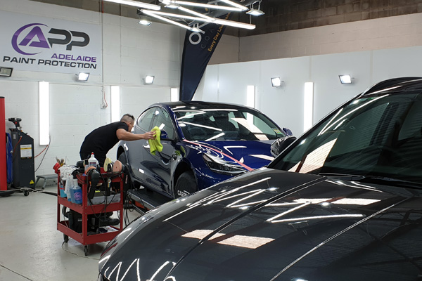 Montha Khan polishing car - Adelaide Paint Protection technician